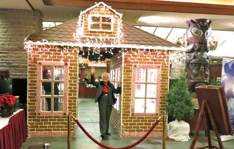 Mom and gingerbread house